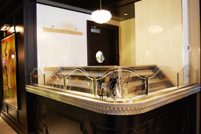 A traditional Parisian seafood bar is within the bar area.