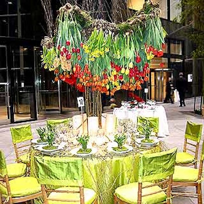 David Beahm's whimsical table display for House & Garden magazine was an upside-down garden of tulips and daffodils, complete with roots reaching for the ceiling. Beahm put a Plexiglas overlay on the table with branches splaying underneath, and each place setting included an individual mini-arrangements.
