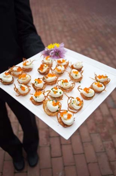 Passed hors d'oeuvres from Jewell Events Catering included 'bird's nests,' made with shredded russet potatoes and halved quail eggs with salmon caviar and snipped chives.