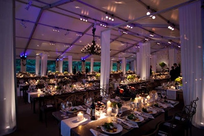 Inside the dinner tent, designer Bill Heffernan used pavilions of white fabric and stainless steel to create a 'dining alfresco' vibe.