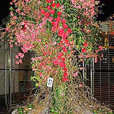 Saundra Parks of the Daily Blossom created a large, overflowing arrangement with red and pink flowers.
