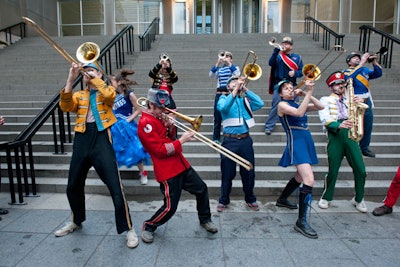 Mucca Pazza, a self-described 'punk circus marching band,' led guests to dinner.