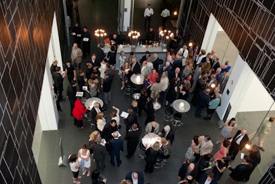 The dessert reception took place on the museum's second floor, where a buffet area offered buttermilk cake with strawberries and warm chocolate truffle cakes with whipped cream and purple spun sugar.