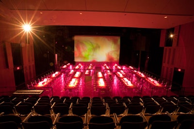 Dinner took place in the theater. Left Wing Scenic extended the stage to seat 300 guests, and a background screen showed images by artist Sterling Ruby.