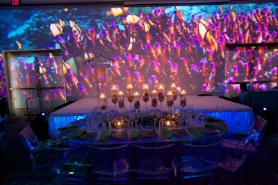 Video projections of underwater activity covered three of the room's four walls.