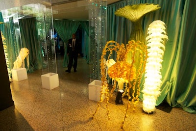 Green draping and coral-like flexi-forms decorated the dinner entryway.
