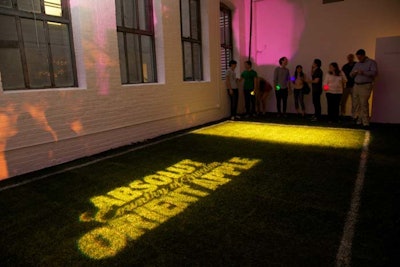 Attendees played with glow-in-the-dark balls on a grassy boccie court.