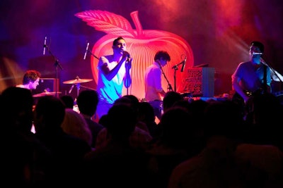 Electropop duo Holy Ghost! was the event's headlining act. They performed on the stage in front of a large canvas backdrop decorated with the image of an apple.