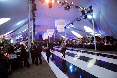 A zebra-inspired dance floor stretched down the center of the tent.