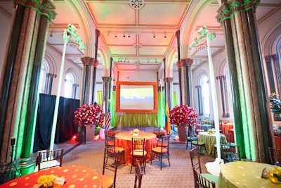 Frost Lighting used orange and green uplights to accentuate the main hall's columns and complement the decor.