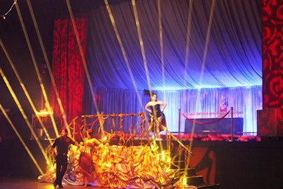 Rather than place all the performers on the venue's stage area, the producers turned the elevated platform into an additional lounge and decorated the staircase with tactile fixtures.