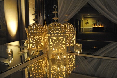 Candlelit lanterns added to the IIFA after-party's South Asian theme. The furniture was white and mirrored.
