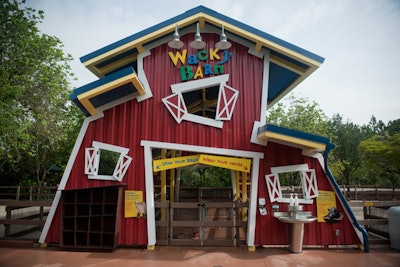 The colorful Wacky Barn has slanted architecture.