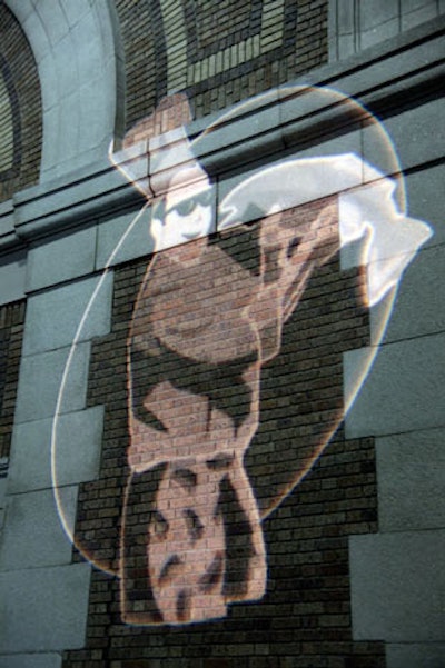 The event's logo of a chef in shorts and shades illuminated the wall of the Seaport Boston.