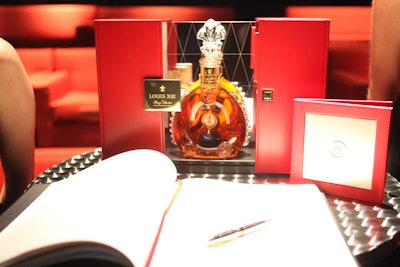 The red hue of the furniture inside the space matched the color of Louis XIII packaging, which stood prominently beside a guest book at the events.