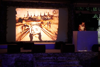 A performance artist in sand animation, Ukrainian talent Kseniya Simonova entertained guests with live artwork inspired by Natalia Vodianova and her Naked Heart Foundation.