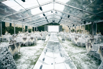 The entire floor of the clear tent was paved with real grass and frosted with faux snow.