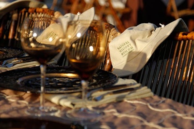 Hats hung on guests chairs, fitting in with the event's dinosaur-hunting theme.