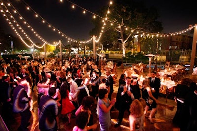 Gobos in swirling patterns illuminated guests.