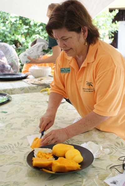 Outdoor activities included mango sampling under tents on the botanic garden's lawn.