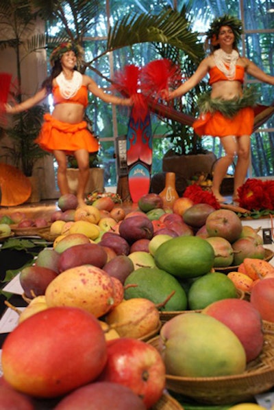 Hula dancers performed onstage at the opening and closing of Sunday's mango auction.
