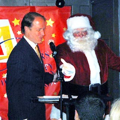 Radio City Music Hall's Santa, Charles Edward Hall, made a surprise visit to present Thomas Madden, managing director of Rockefeller Plaza and Tishman Speyer Properties, an award.