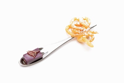 A peanut butter and jelly funnel cake served on a custom-designed utensil