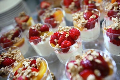 Occasions Caterers served yogurt parfaits with raspberries, nuts, and mandarin oranges as part of its breakfast buffet.