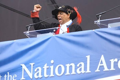 An actor dressed as Private Ned Hector, a Revolutionary War hero, led the crowd in the classic historical huzzah, a call of exclamation common to the time period.