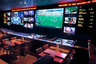 The Sporting House's screening room is on the first floor and can become a private room for events. The room has two 16-foot, high-definition screens and a dozen 36-inch, high-definition video monitors.