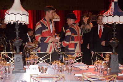 The tables were dressed with custom '50s-style lampshades in blue and red. Amanda Davis designed the bespoke shades and turned to Lotus Lampshades to manufacture them in rich silks, brocades, beads, and tassels, working from an 18th-century stone chapel in rural Wales.