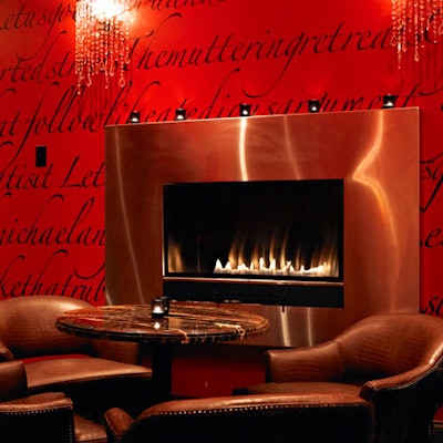 The red-walled room has its own fireplace.