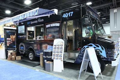Mark Edwards, director of marketing and events for DPI Specialty Foods, replaced their standard, grid-type booth with a 23-foot-long black food truck, rented locally. Edwards saved budget dollars on construction and setup costs.