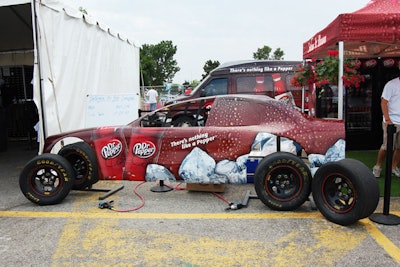 At the Dr. Pepper Pit Stop Challenge, visitors raced to see who could change a tire the fastest.
