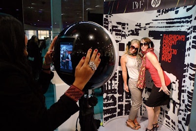 No one was more impressed than I by the success of the first Fashion’s Night Out in 2009. That’s why its failure in 2010 was so stunning. Tacky crowds of freebie hunters made asses of themselves, like at this gawdy HP photo booth in Diane von Furstenberg’s shop.