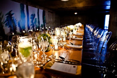 In the wine cellar, clear chairs lined the winery's harvest tables. Dim lights and candles provided ambience.