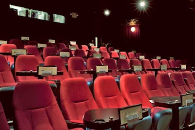 In total, the Nitehawk Cinema has three screening rooms. The largest seats 90 and the smallest 28. Small tables with cup holders between every two seats allow moviegoers to eat meals prepared by the kitchen.