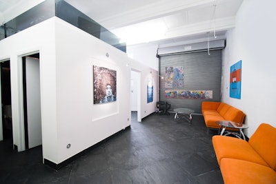 The gallerylike space, which can be seen from the elevated DJ booth, has art niches with gallery lighting and orange vintage seating.