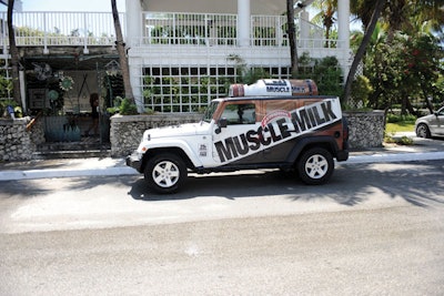 The logo-clad Muscle Milk vehicle parked outside the venue.