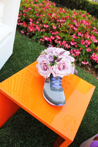 As a tongue-in-cheek way to decorate the event, MKG used shoes instead of vases to hold floral arrangements.