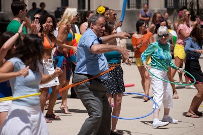 Office workers and passerby stopped to play games like hula hooping and beach noodle jump rope.