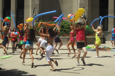 Working with AgencyEA, planners hired around 40 dancers and actors to kick off the summer beach party.