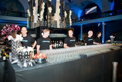 Faux crocodile shelving units stacked to create a back bar that held various vases.