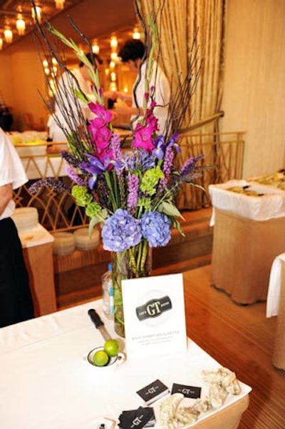 A tall summer flower arrangement decorated the tasting station for GT Fish & Oyster.