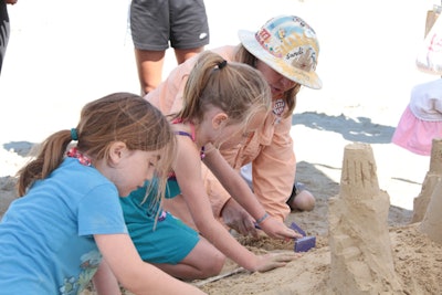 Activities in the children's village included sand sculpting lessons.
