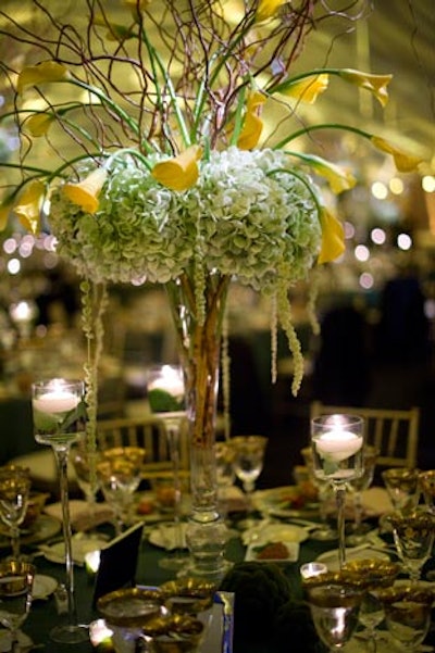 Event Creative's centerpieces were eight feet tall. Designers arrived on site at 6 a.m. to fill them, and then ran them to the dinner tent in the morning's torrential downpour.