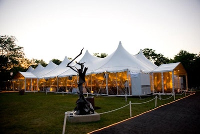 An illuminated walkway lead to the dinner tent.