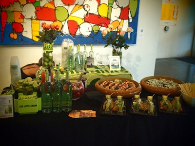 Ingredients for caipirinhas stood on a table display with SushiSamba appetizers.