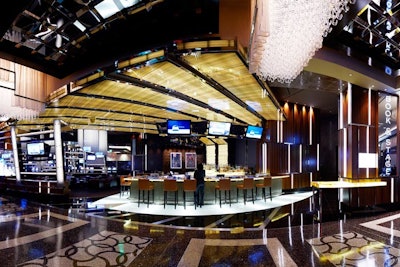 Book & Stage at the Cosmopolitan is a place to bet on live sporting events from around the world by day. At night, the stage above the bar features live musicians.