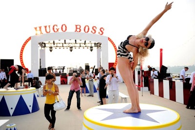 Atop the Starrett-Lehigh Building, Hugo Boss invited hundreds of guests to a summer party. This year, the annual shindig had a circus theme, produced by SPEC Entertainment, with custom red and white scenic elements and carnival-style performers.